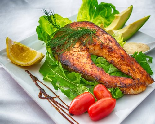 Fresh sea fish and green vegetables representing a healthy Omega-3 rich diet